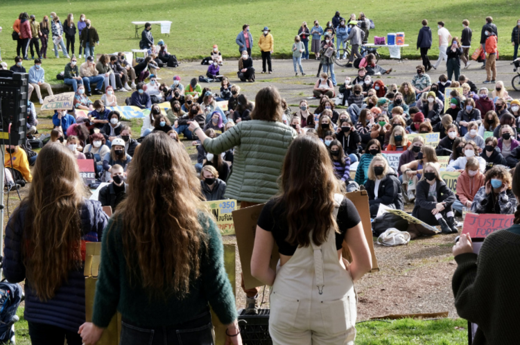 Wide-angle shot of a speech, taken from behind the speaker